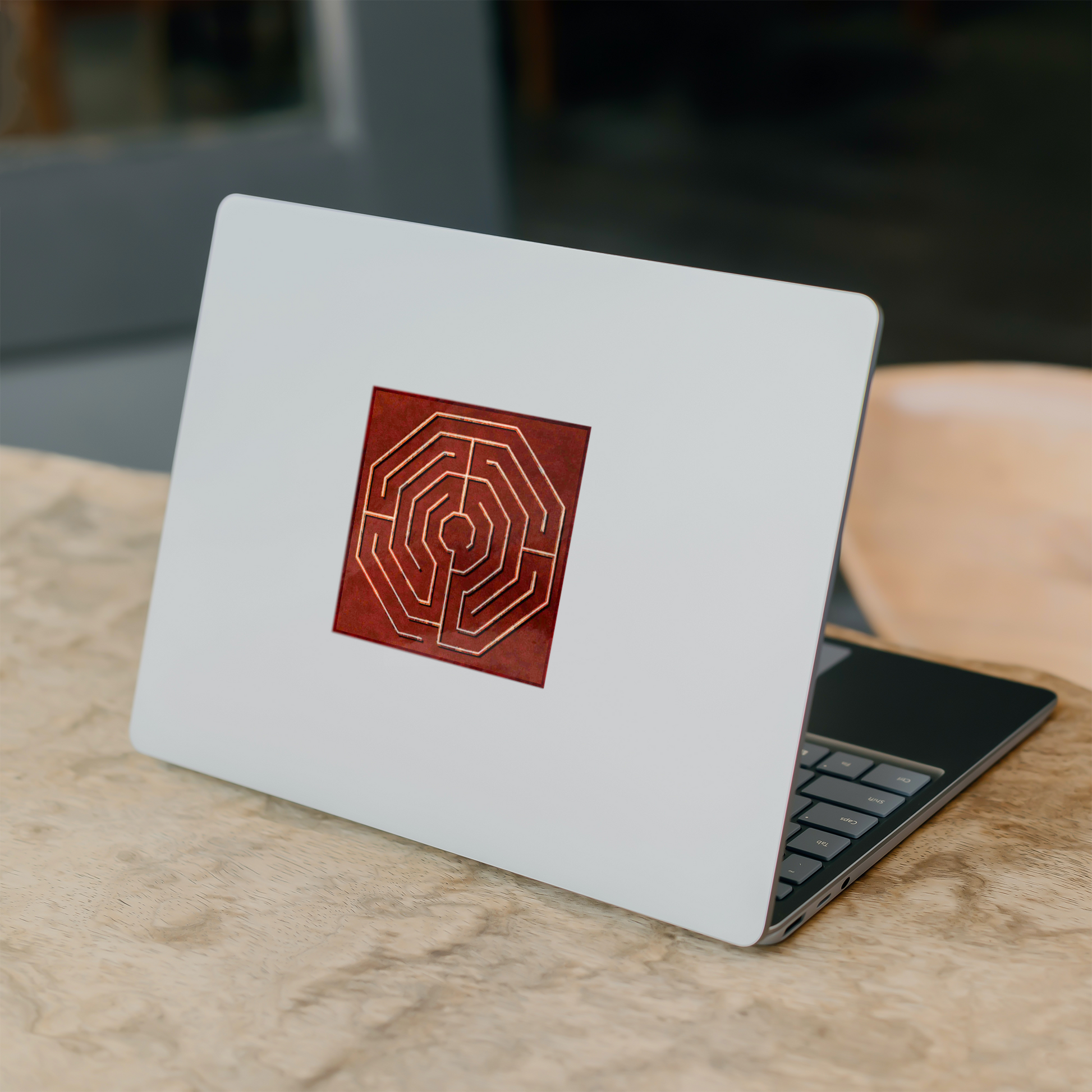 Octogon_Labyrinth_Sticker_WhiteSquareSticker_Laptop_Mockup.png